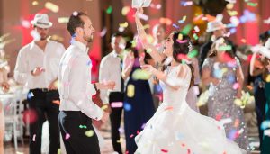 Bride and groom celebrating on the dance floor at a Miami wedding