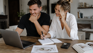 Couple planning their wedding DJ song list
